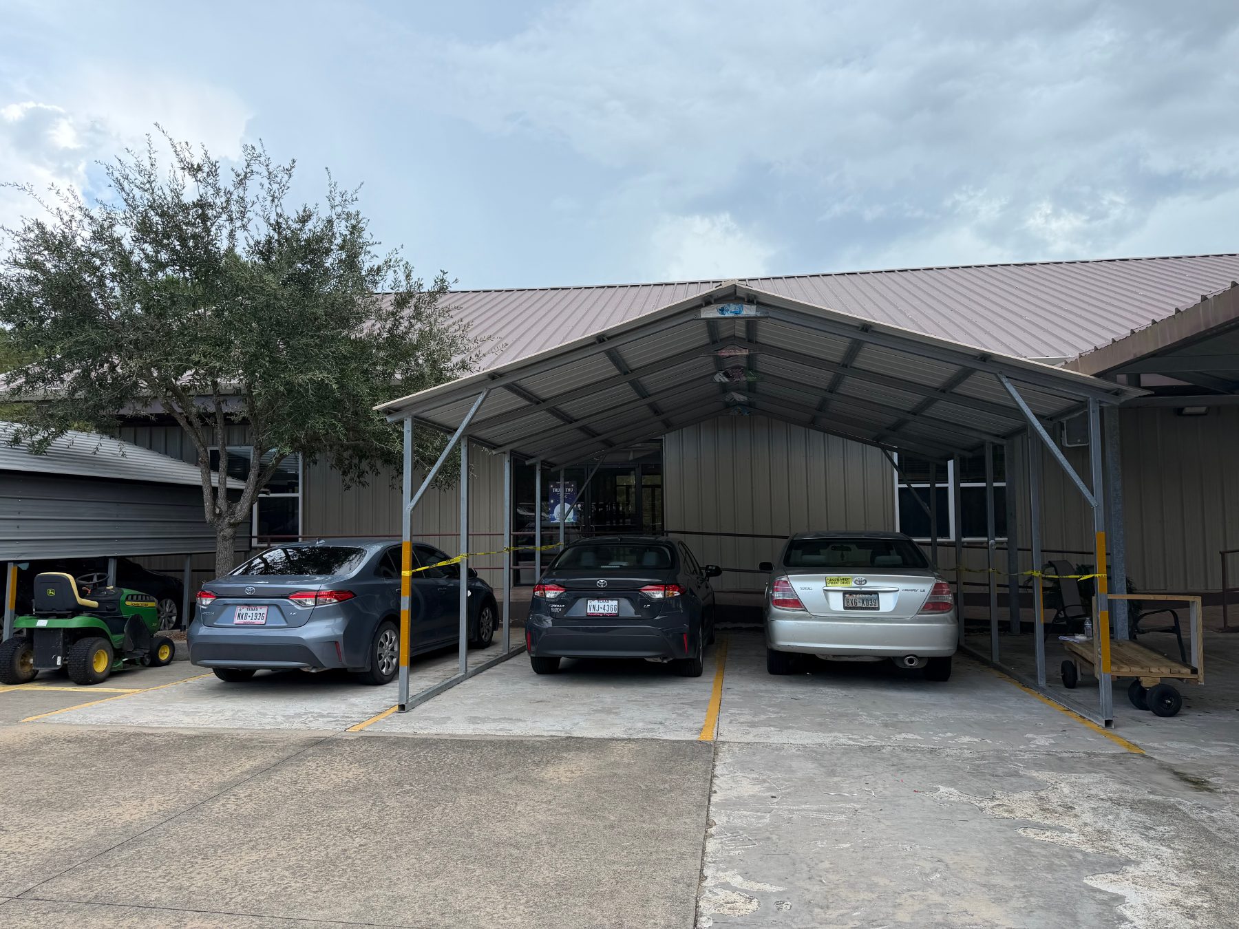 Covered parking beside the hall