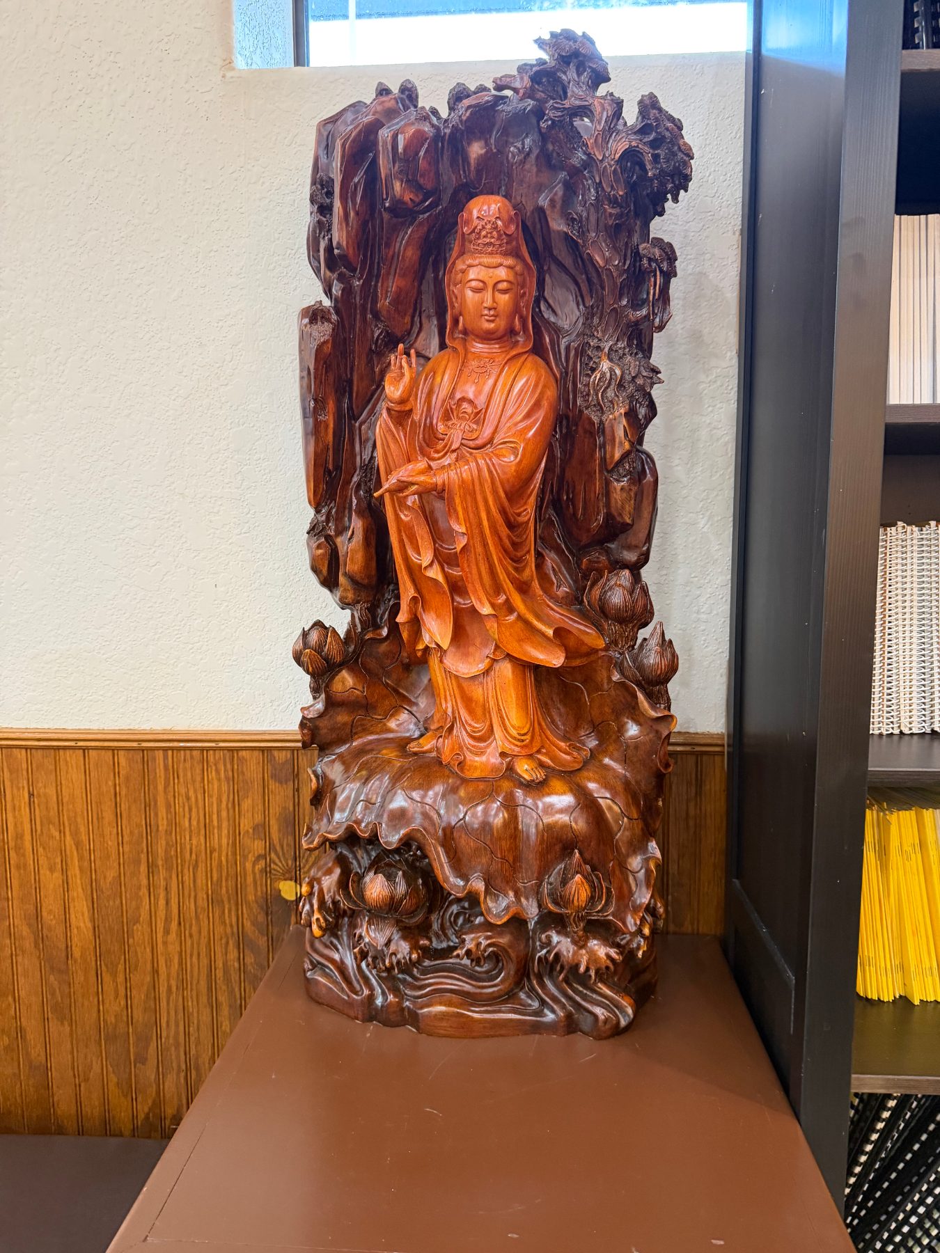 A carved wooden Quan Âm in the temple